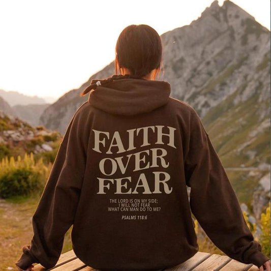 Unisex brown Christian hoodie by Mandotos featuring faith over fear message and Psalm 118:6 Bible verse design.