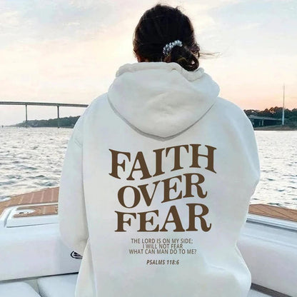 Unisex brown Christian hoodie by MANDOTOS featuring the Bible verse Psalms 118:6 "Faith Over Fear" printed on the front.