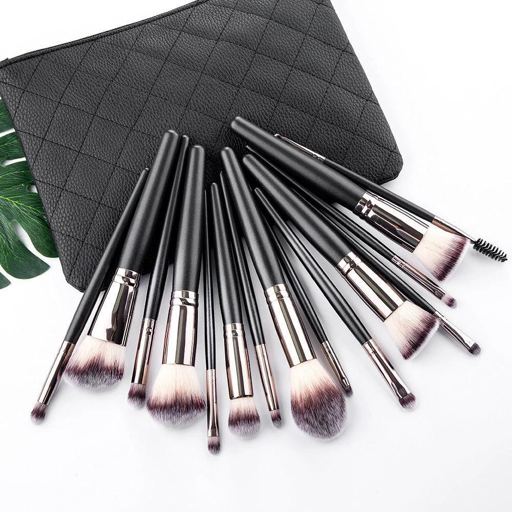 Mandotos matte black makeup brush set with 15 essential brushes for flawless makeup application on a clean surface.