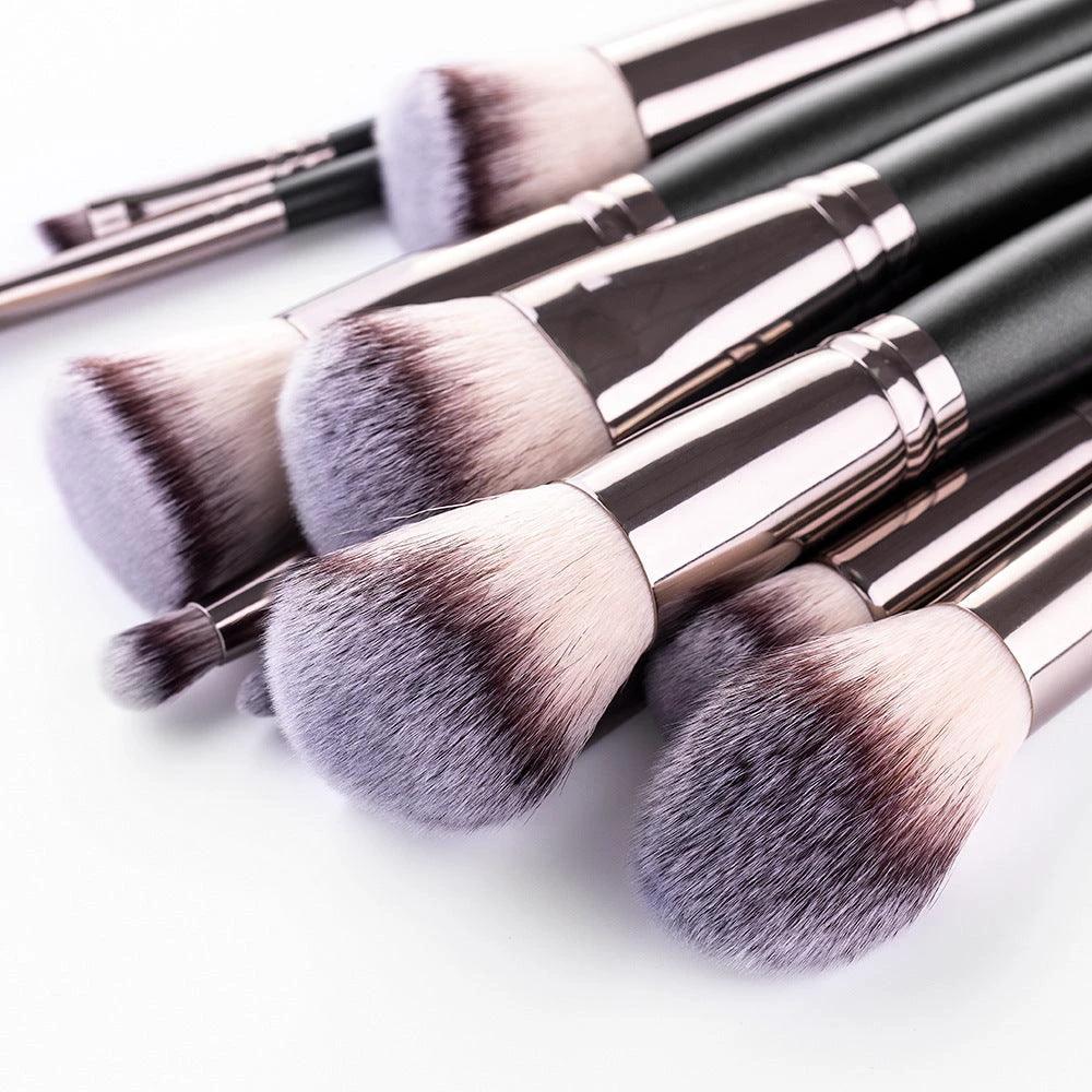 Matte black MANDOTOS makeup brush set with 15 essential brushes for flawless makeup application, displayed with brushes arranged neatly.