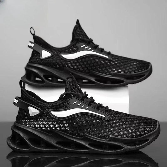 Men's black lace-up sneakers by MANDOTOS with mesh upper, hollow sole, and low-top design, suitable for running and sports activities.