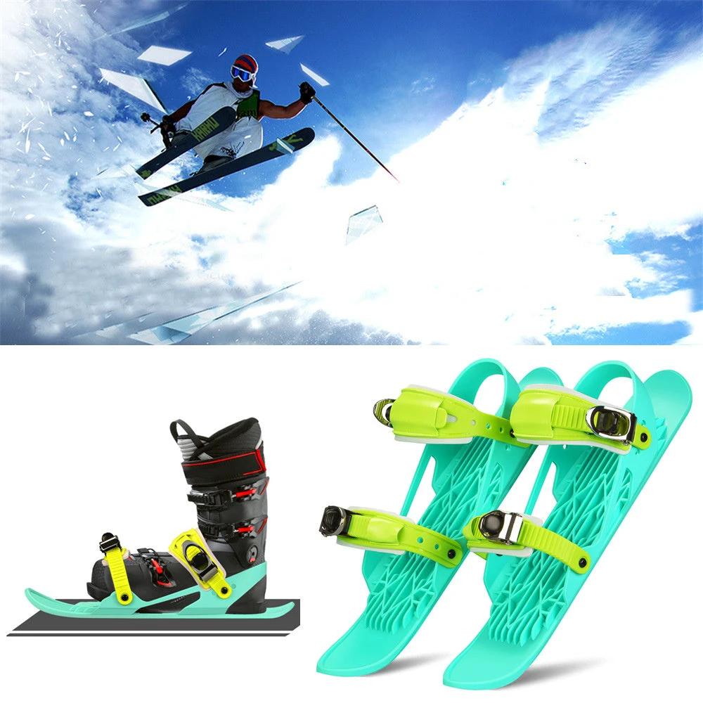 Mandotos Mini Ski Skates, portable and adjustable short skiboard for snow, shown in a winter outdoor setting.