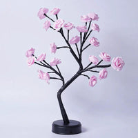 Mandotos Rose Flower Tree Table Lamp with USB fairy night light on a desk, decorative floral design for cozy lighting.