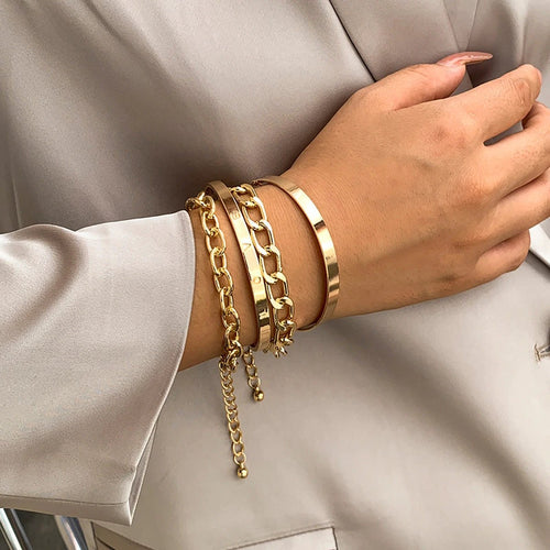 Mandotos C-shaped hollow chain bracelet set with simple, smooth design, featuring multiple bracelets for stylish layering.
