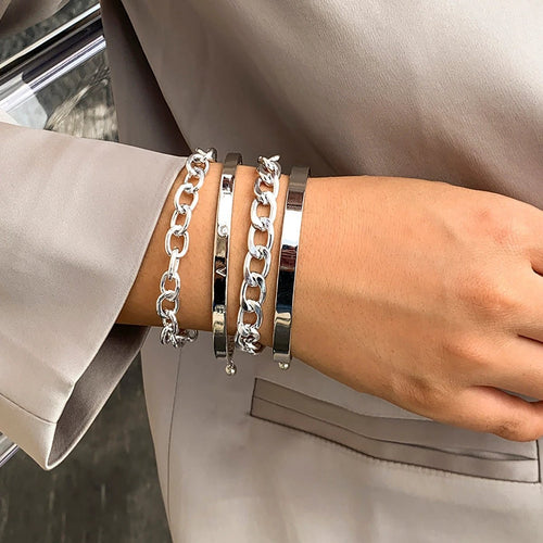 Mandotos C-shaped hollow chain bracelet set featuring simple, smooth design with multiple bracelets for a stylish look.
