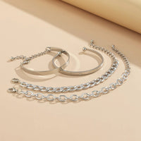 Mandotos C-shaped hollow chain bracelet set featuring simple, smooth design with multiple silver-toned bracelets on a white background.