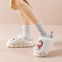 Pair of MANDOTOS snowman slippers with plush lining and anti-slip soles, perfect for cozy winter home wear for couples.
