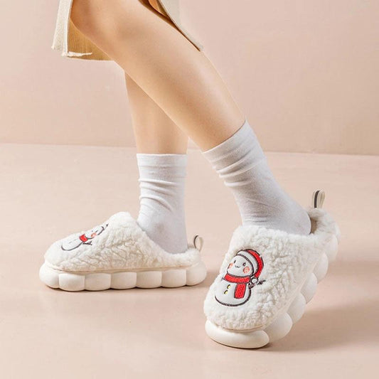Pair of MANDOTOS snowman slippers with plush lining and anti-slip soles, perfect for cozy winter home wear for couples.