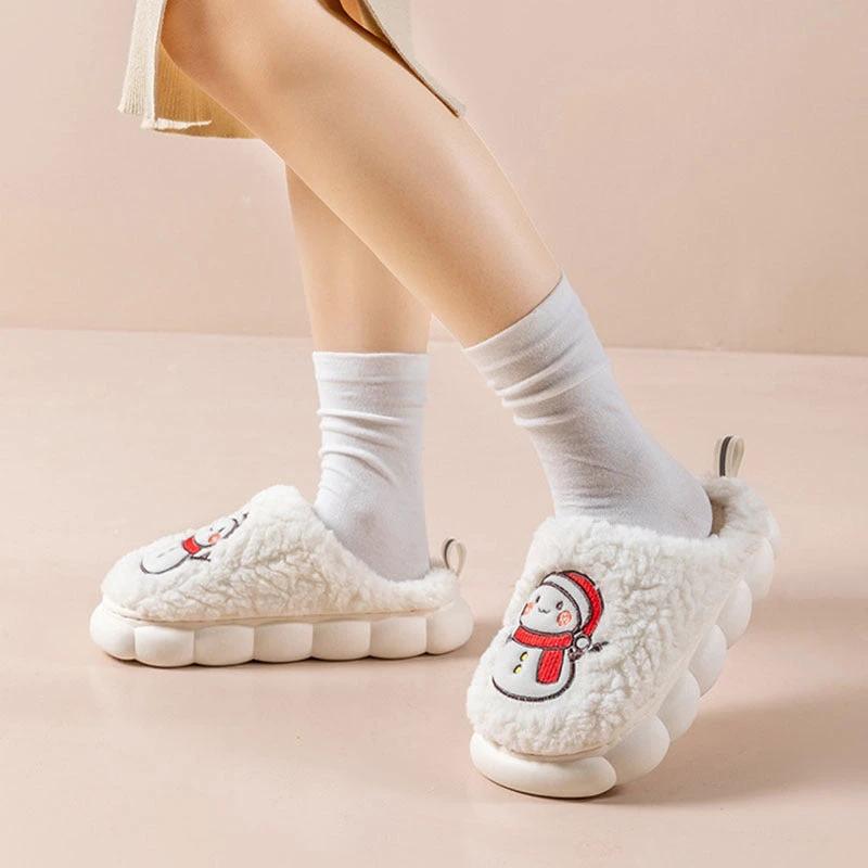 Pair of MANDOTOS snowman slippers with plush lining and anti-slip soles, perfect for cozy winter home wear for couples.