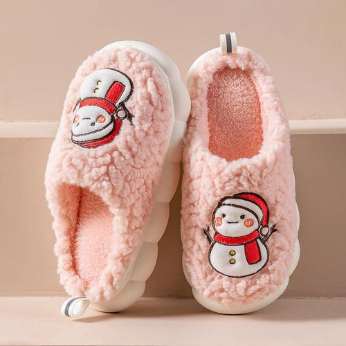 Pair of MANDOTOS Snowman Slippers for winter, plush, anti-slip couple home shoes with festive snowman design.