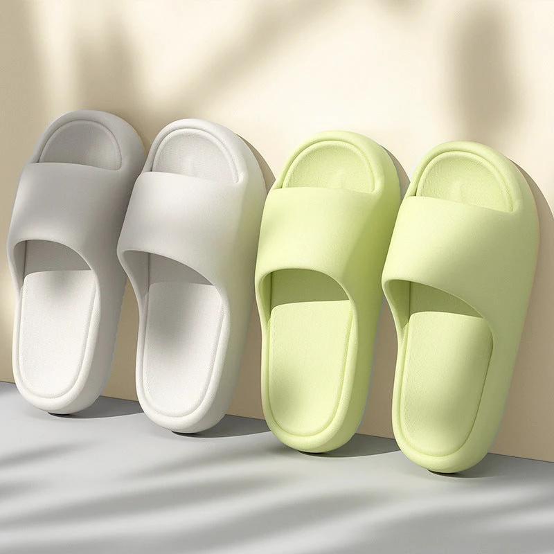Mandotos solid thick-soled home slippers for women and men, summer non-slip bathroom and house shoes on a neutral background.