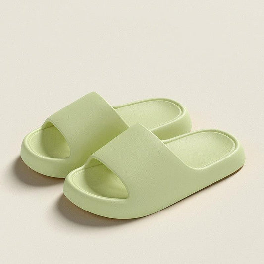 Mandotos solid thick-soled home slippers for women and men, summer non-slip bathroom house shoes on a tiled floor.