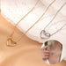 Stainless steel twist hollow heart necklace on a clavicle chain, featuring a sleek, modern design by MANDOTOS.