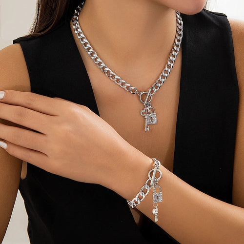 Mandotos thick chain lock and key pendant necklace, trendy fashion jewelry with bold design and metallic finish.