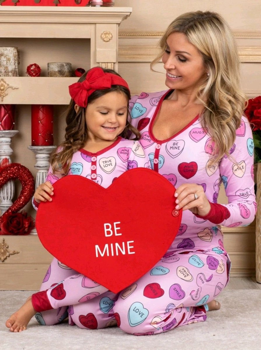 Matching Valentine's Day love print pajamas for parent and child by MANDOTOS, featuring cozy, festive sleepwear for both.