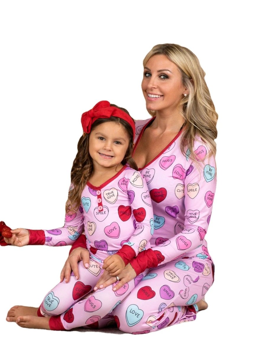 Matching Valentine's Day love print pajamas for parent and child by MANDOTOS, featuring cozy, festive sleepwear sets.