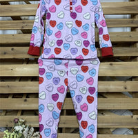 Matching Valentine's Day love print pajamas for parent and child by MANDOTOS, featuring cozy, festive sleepwear sets.