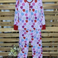 Matching Valentine's Day love print pajamas for parent and child by MANDOTOS, featuring cozy, festive sleepwear with love-themed designs.
