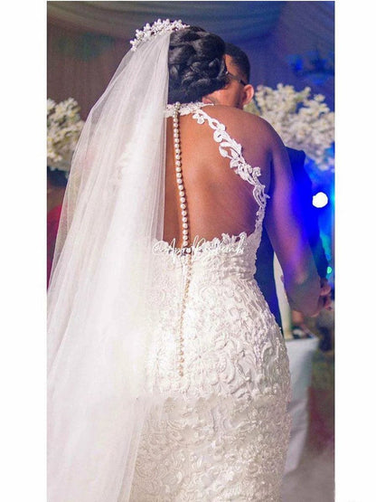 Mandotos vintage lace beaded mermaid wedding dress with sheer neckline, fitted silhouette, and intricate beadwork for bridal elegance.