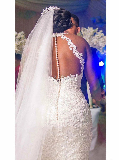 Mandotos vintage lace beaded mermaid wedding dress with sheer neckline, fitted silhouette, and intricate beadwork for bridal elegance.