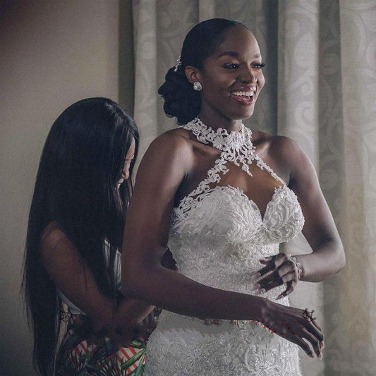 Mandotos vintage lace beaded mermaid wedding dress with sheer neckline and intricate detailing, perfect for bridal occasions.