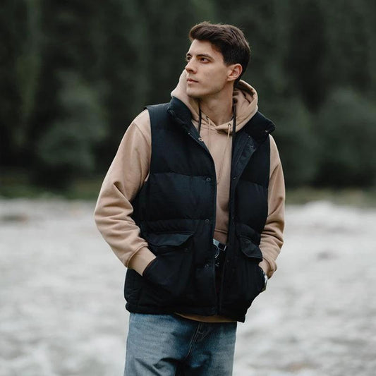 White duck down vest by MANDOTOS, a men's three-proof jacket with insulated, lightweight design for warmth and protection.
