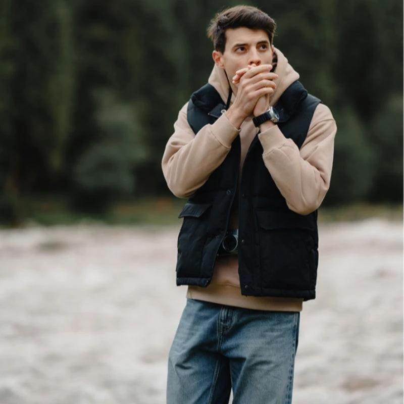 White duck down vest by MANDOTOS, a men's three-proof jacket with insulated, lightweight design and waterproof, windproof features.