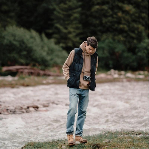 White duck down vest by MANDOTOS, men's ultra-effective three-proof jacket with insulated design and sleek white exterior.