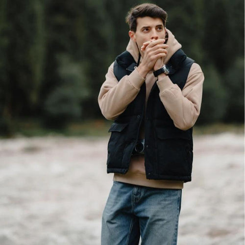 White duck down vest by MANDOTOS, a men's three-proof jacket featuring insulated, lightweight, and durable design.