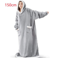 Mandotos winter TV hoodie blanket worn by woman and man, oversized cozy pullover with pockets for warmth and comfort at home.