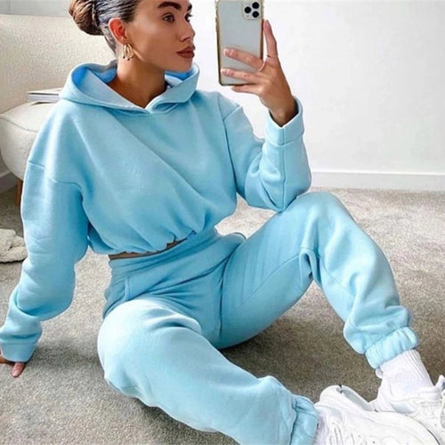 Women's 2-piece jogging suit by MANDOTOS featuring a sexy long sleeve hoodie and matching pants for active wear.