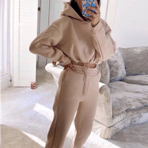 Women's 2-piece jogging suit by MANDOTOS featuring a sexy long sleeve hoodie and matching tracksuit pants.