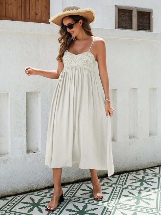 Women's Bohemian Maxi Dress by MANDOTOS featuring breathable rayon fabric, embroidered bust, elastic back, and flowy skirt in black, white, and green.