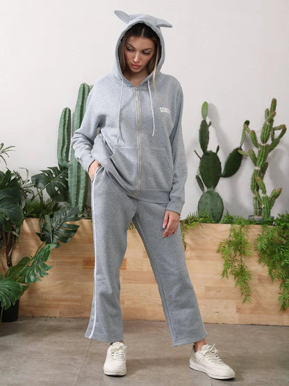 Women's long-sleeved hoodie set by MANDOTOS, featuring a comfortable top and matching pants in soft fabric.