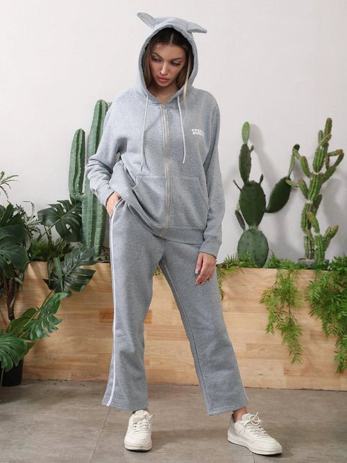 Women's long-sleeved hoodie set by MANDOTOS, featuring a comfortable top and matching pants in soft fabric.