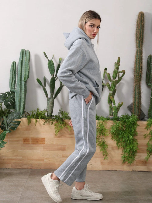 Women's long-sleeved hoodie set by MANDOTOS, featuring a comfortable hoodie and matching pants in soft fabric.