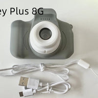 Mandotos X2 HD Mini Cartoon Kids Digital Camera showing colorful cartoon design and compact handheld size for children.