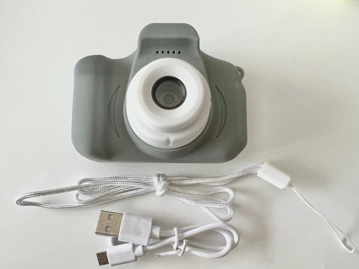 Mandotos X2 HD Mini Cartoon Kids Digital Camera showing colorful cartoon design and compact size for children.