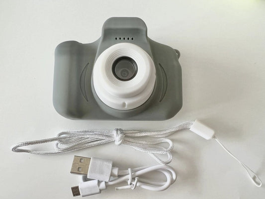 Mandotos X2 HD Mini Cartoon Kids Digital Camera showing colorful cartoon design and compact size for children.