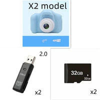 Mandotos X2 HD Mini Cartoon Kids Digital Camera showing colorful cartoon design and compact size for children.
