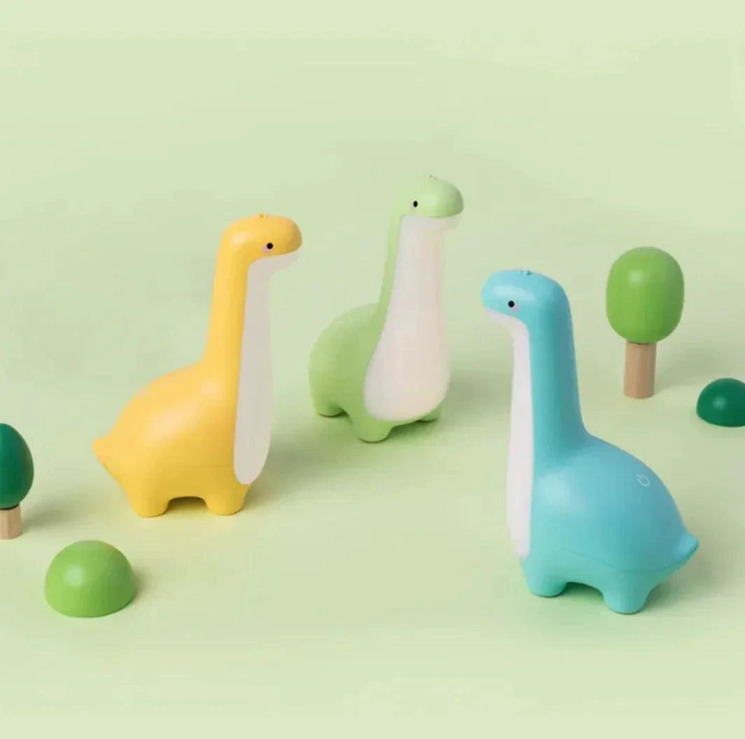 Mandotos Dino Dream Light glowing with friendly dinosaur shape, soft LED illumination for cozy bedroom decor or nightlight.
