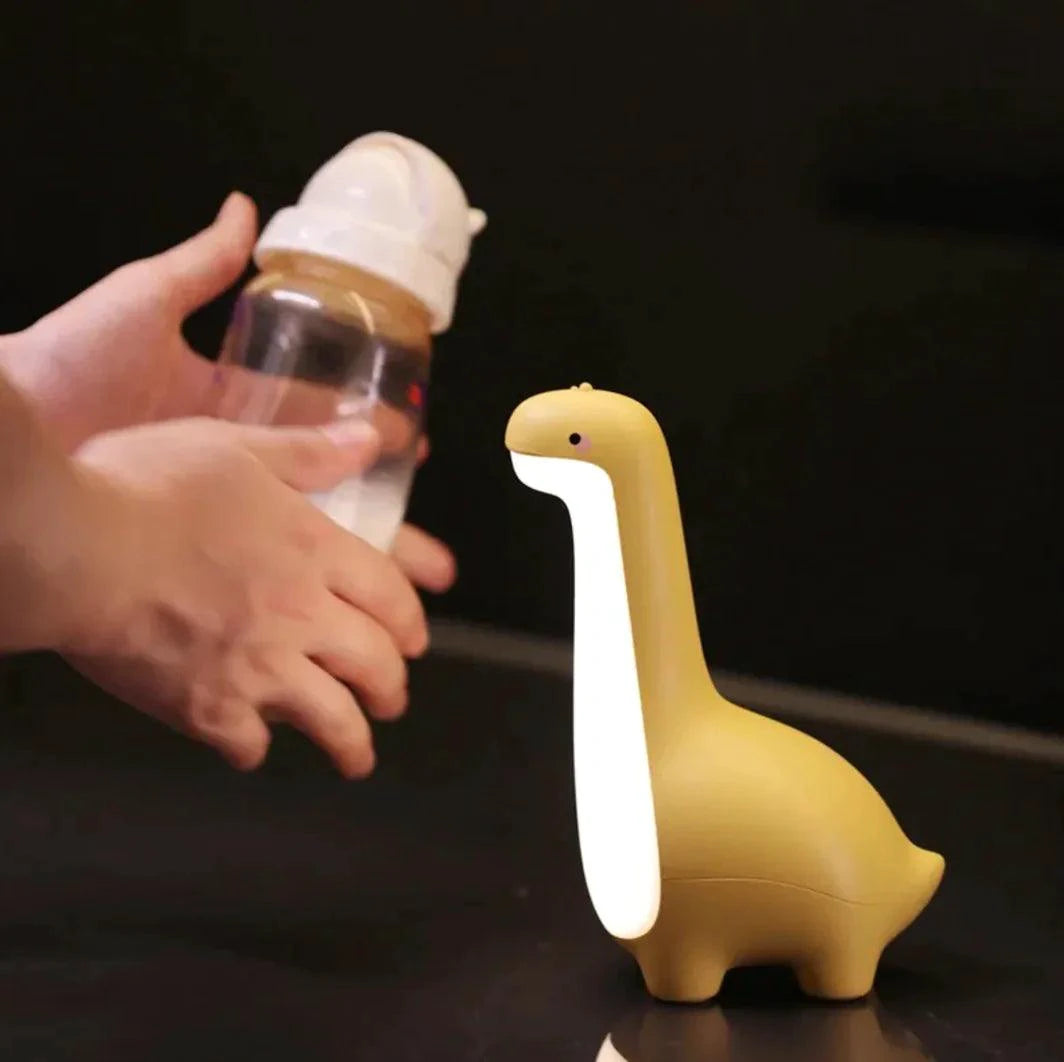 Mandotos Dino Dream Light illuminating a cute dinosaur-shaped night light for kids' bedroom decor.