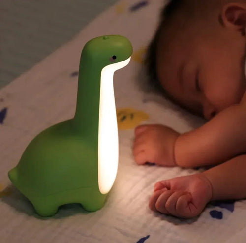 Mandotos Dino Dream Light, a cute dinosaur-shaped night light with soft glow for kids' bedrooms.