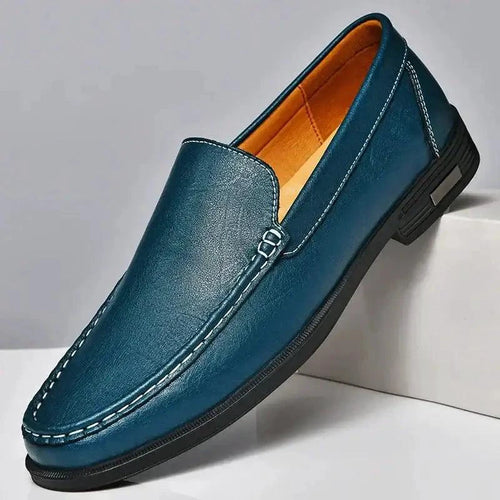 Mandotos Eco-Chic Leather Loafers featuring sleek design, brown leather, and a comfortable slip-on style.