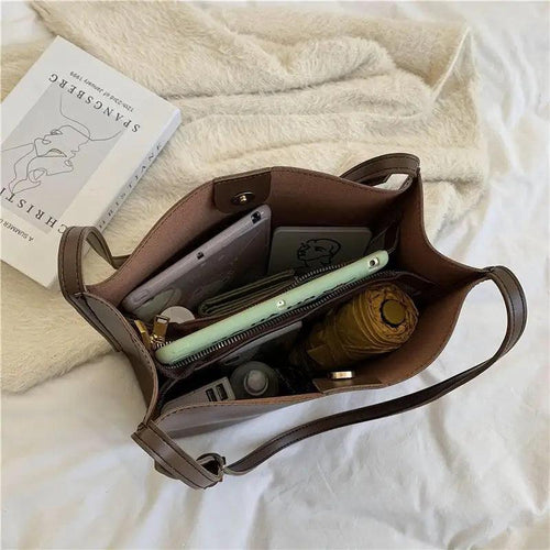 Mandotos eco-friendly vegan leather tote bag with stylish, sustainable design, featuring spacious interior and sleek brown finish.