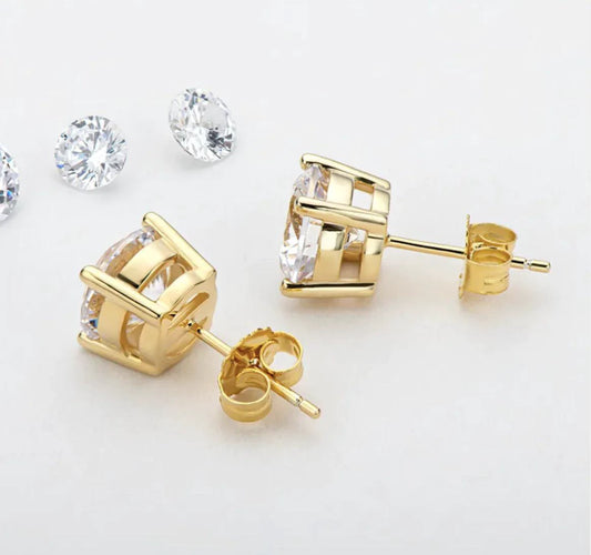 Elegant 18K gold and silver moissanite stud earrings by MANDOTOS, showcasing sparkling gemstones on a classic stud setting.