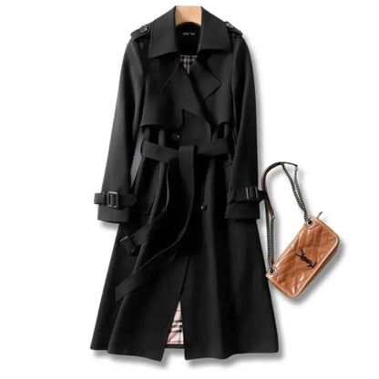 Mandotos elegant classic trench coat displayed on a hanger, featuring a tailored fit, neutral color, and stylish collar details.