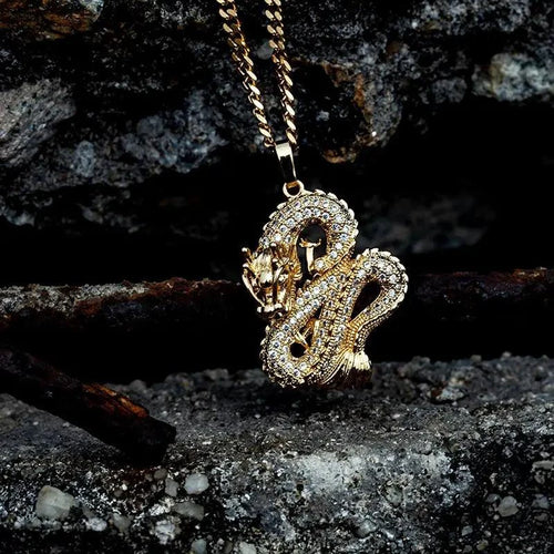 Elegant gold zircon dragon pendant by MANDOTOS featuring detailed dragon design and sparkling zircon accents.