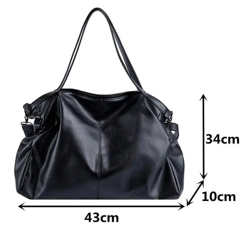 Elegant leather carryall bag by MANDOTOS, showcasing its stylish design and spacious interior for daily use.