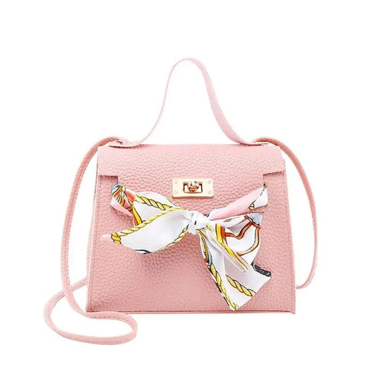 Elegant leather handbag and matching scarf from MANDOTOS, featuring stylish design and high-quality craftsmanship.